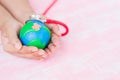 Soft focus of Woman hand holding handmade globe Royalty Free Stock Photo