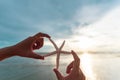 Soft focus on woman hand holding starfish over sea Royalty Free Stock Photo