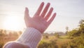 Soft focus Woman hand reaching towards nature and sky Royalty Free Stock Photo