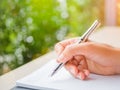Soft focus woman hand writing, business document and note book Royalty Free Stock Photo