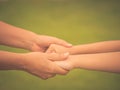 Soft focus woman holds the hand of a lovely child. Royalty Free Stock Photo