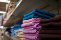 Soft focused close up shot of a stack of kitchen or bath towels on supermarket shelf