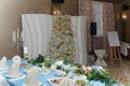 Soft focused shot of decorated wedding hall. Festive table and arch for just married, event organization Royalty Free Stock Photo