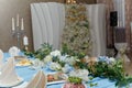 Soft focused shot of decorated wedding hall. Festive table and arch for just married, event organization Royalty Free Stock Photo