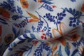 Soft fold on colorful fabric with floral pattern Royalty Free Stock Photo