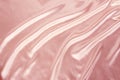 Soft folds on delicate pink shining silk, luxury concept, background for the designer, horizontal, close-up, copy space