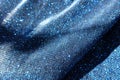 Soft folds on shiny blue lurex fabric Royalty Free Stock Photo