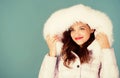 Soft fur. Winter season. Woman wear down jacket with furry hood. Style code with elegance. For those wishing stay modern