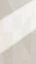 Soft Geometric Pattern with Diagonal Light Shadow Across a Light Beige Textured Wall Creating a Subtle Abstract Background Royalty Free Stock Photo