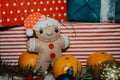 Soft gingerbread man decoration on a background with Christmas decorations