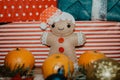 Soft gingerbread man decoration on a background with Christmas decorations
