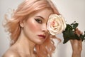 Soft-Girl Style with Trend Pink Flying Hair, Fashion Make-up. Blond Woman Face with Freckles, Blush Rouge, Rose Flower