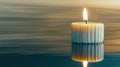 Soft Glow of a Candle Flame Illuminating Tranquility on a Serene Black Surface Royalty Free Stock Photo