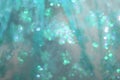 Soft glowing golden green-blue festive background. Colored abstract blurry backgrounds. New Year Royalty Free Stock Photo