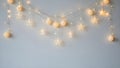 Soft glowing star and ball string lights on wall Royalty Free Stock Photo