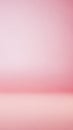 Soft gradient background transitioning from a light pink to a deeper rose hue with a subtle horizontal line suggesting a floor or Royalty Free Stock Photo