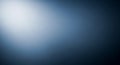 Subtle gradient background with a bright white light on the left fading into a deep, dark blue-gray Royalty Free Stock Photo