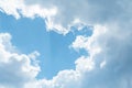 Soft gray clouds against a sunlight in blue sky background