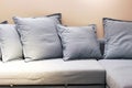 Soft gray pillows on the couch front view, close-up Royalty Free Stock Photo