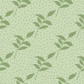 Soft green foliage ornament seamless botanic pattern. Light pastel background with dots. Floral stylized print Royalty Free Stock Photo