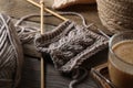 Soft grey woolen yarn, knitting and needles on wooden table, closeup Royalty Free Stock Photo