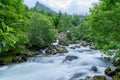 Soft hazy waterfall running down a mountainside in Norway Royalty Free Stock Photo