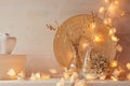 Soft home decor with burning lights on white wooden background. Royalty Free Stock Photo