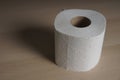 Soft hygienic toilet paper on wood background