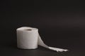 Soft hygienic white toilet paper, on black background