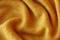 Soft knitted yellow sweater texture closeup. Light orange abstract background Royalty Free Stock Photo