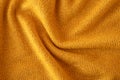 Soft knitted yellow sweater texture closeup. Light orange abstract background Royalty Free Stock Photo