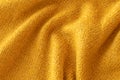 Soft knitted yellow sweater texture closeup. Light orange abstract background Royalty Free Stock Photo