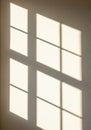 Soft light filters through a window with a grid pattern, casting sharp rectangular Royalty Free Stock Photo