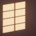 Soft light forms a grid pattern, resembling a window shadow on a wall. The shapes Royalty Free Stock Photo