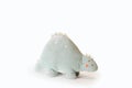 Soft light green Stegosaurus dinosaur plushie toy isolated on white background with shadow reflection. The concept of Royalty Free Stock Photo