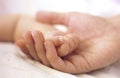 Little baby hand in mothers hand close up Royalty Free Stock Photo