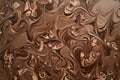 A soft mocha mousse background with intricate swirls of cocoa and hints of espresso brown. ai