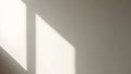 Soft natural light casting geometric shadows on smooth beige wall Royalty Free Stock Photo