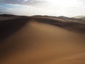 Soft natural rusty red sand dune and bright sky of vast desert landscape copyspace background with hot sunlight, Sossus Royalty Free Stock Photo