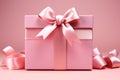 Soft pastel: Blank pink gift box with ribbon on isolated pink backdrop.