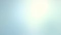 Soft pastel blue and white gradient background with bright light flare for abstract design concepts Royalty Free Stock Photo