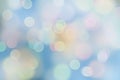 Soft pastel bokeh background with glowing light circles on blue Royalty Free Stock Photo