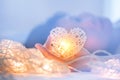 Soft pastel Orange Lamp in Bamboo baskets in the heart shape on Two hand Royalty Free Stock Photo