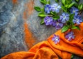 Soft Periwinkle Flat Lay with Stonewashed Fabric Warm Orange Accents and a Delicate Breezy Aesthetic A Study in Royalty Free Stock Photo