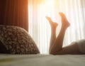 Soft photo of woman sunny morning on the bed