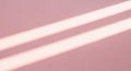 Soft pink background with diagonal light stripes Royalty Free Stock Photo