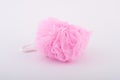 Soft pink bath puff or sponge on white background Royalty Free Stock Photo
