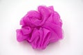 Soft pink bath puff on white background Royalty Free Stock Photo