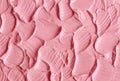 Soft pink cosmetic clay facial mask, cream texture close up, selective focus. Abstract background with brush strokes. Royalty Free Stock Photo