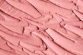 Soft pink cosmetic clay facial mask, cream texture close up, selective focus. Abstract background with brush strokes. Royalty Free Stock Photo